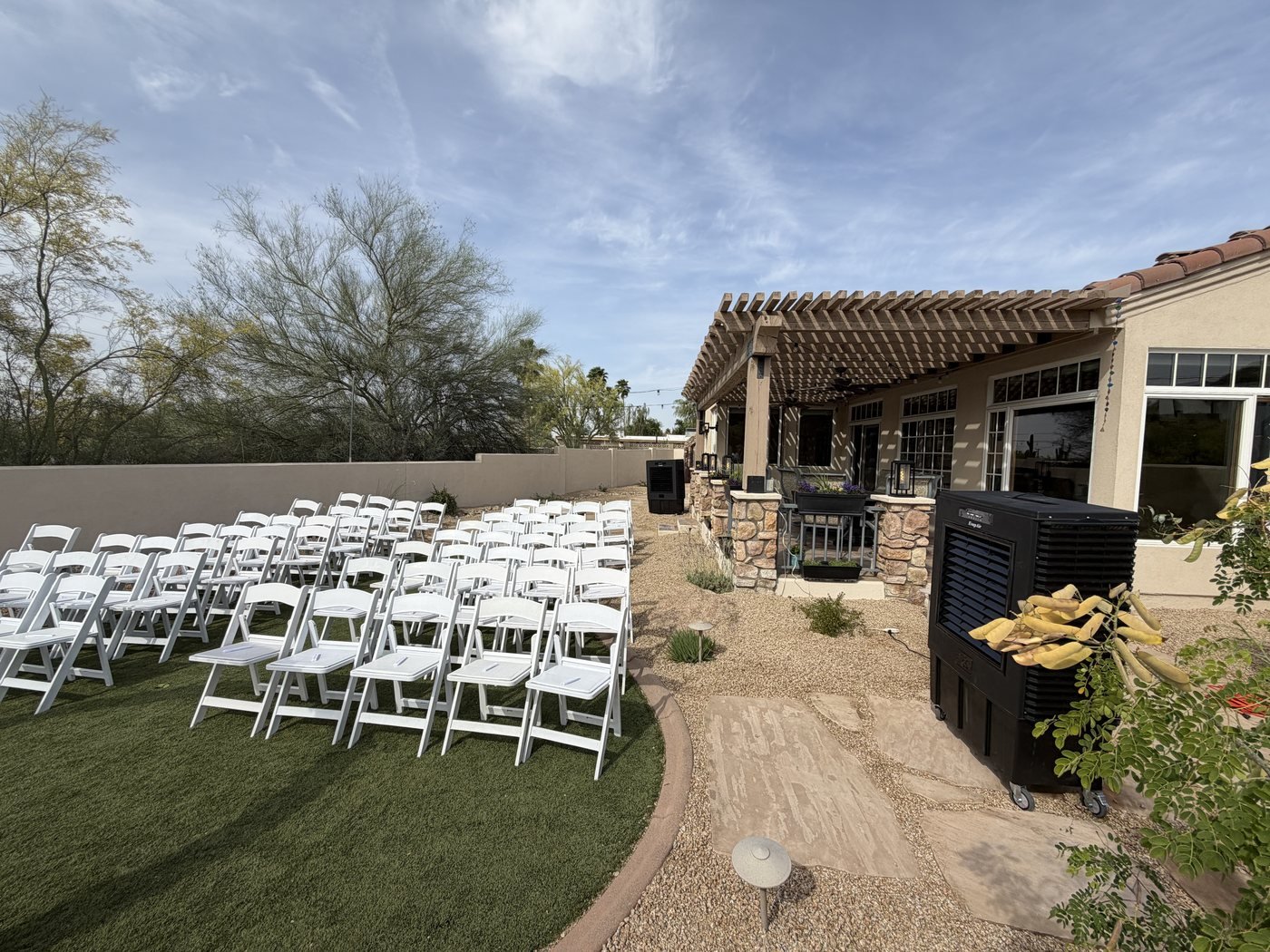 Wedding ceremony cooled by evaporative units