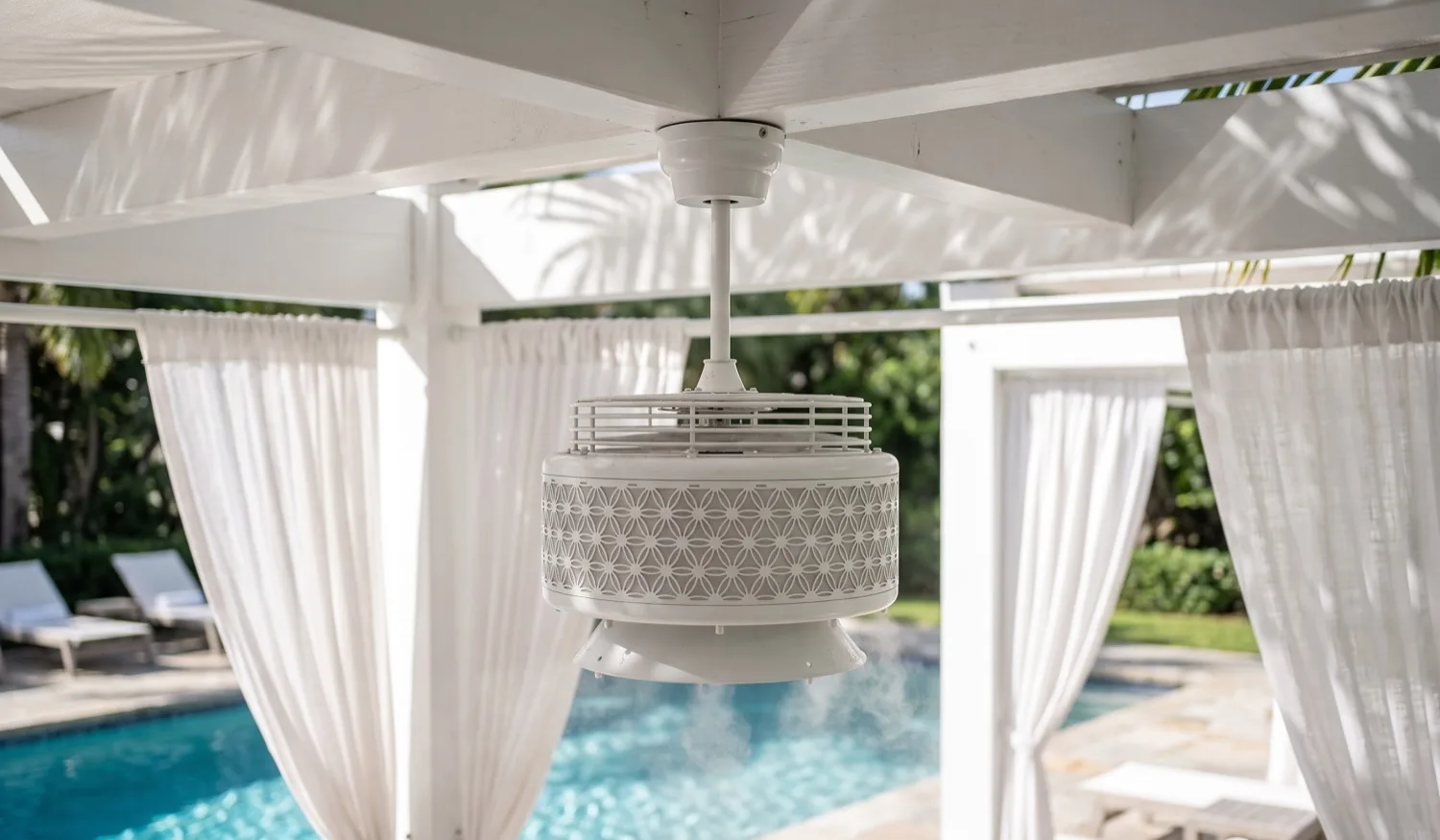 A dry book and phone by the pool under the fan
